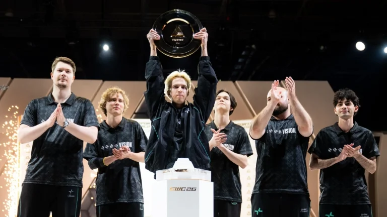 PARIVISION players lifting the EWC 2026 Dota 2 trophy in Paris