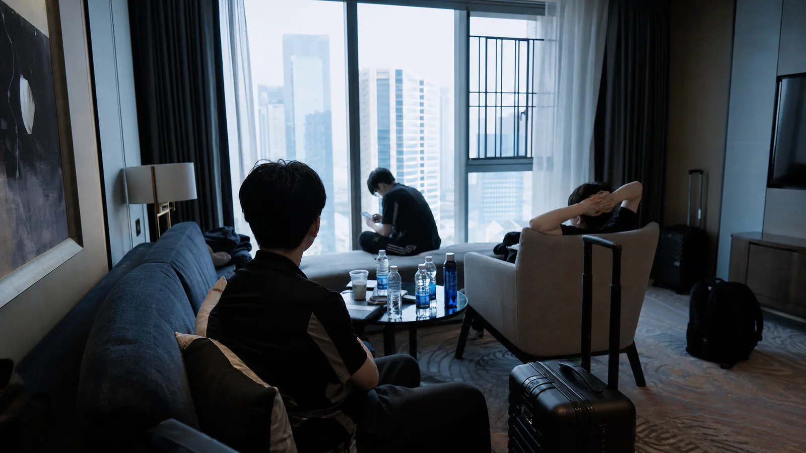 Esports team recovering in a hotel lounge after international travel