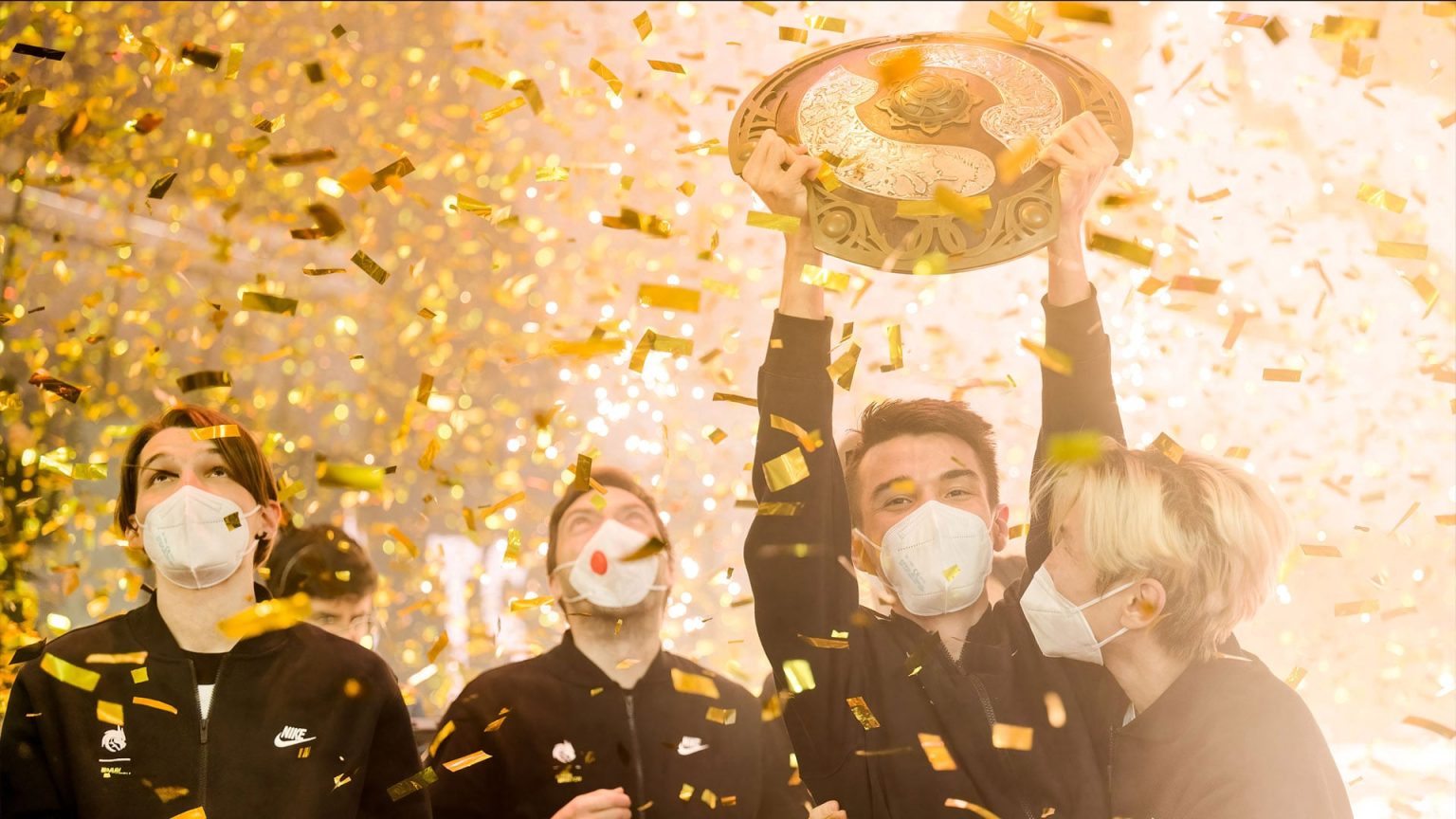Team Spirit holding the Aegis after winning The International 2021