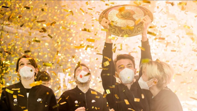 Team Spirit holding the Aegis after winning The International 2021
