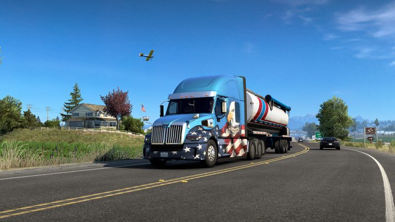 Truck driving through a scenic American landscape