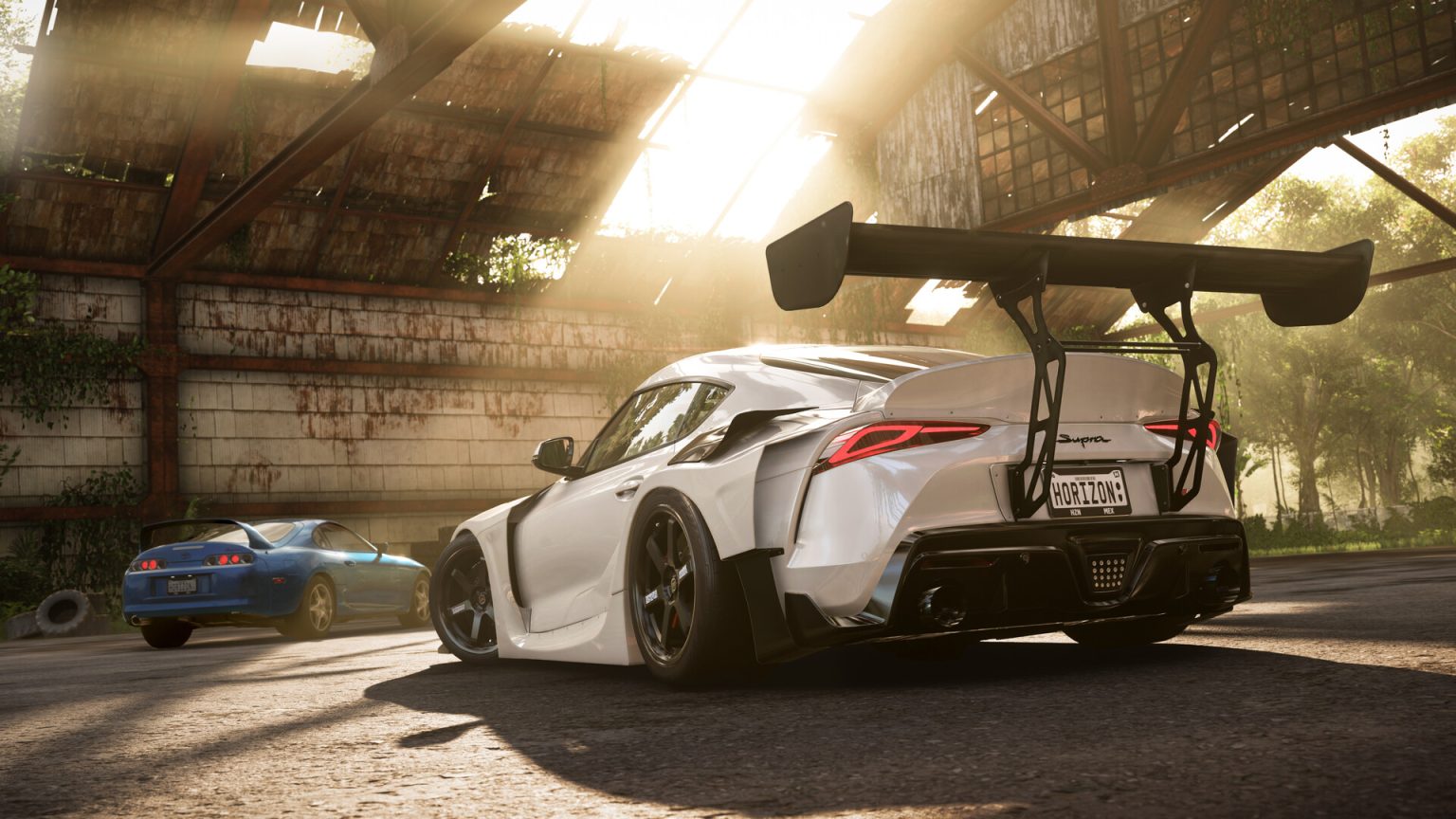 Sports cars racing through a wet road in Forza Horizon 5